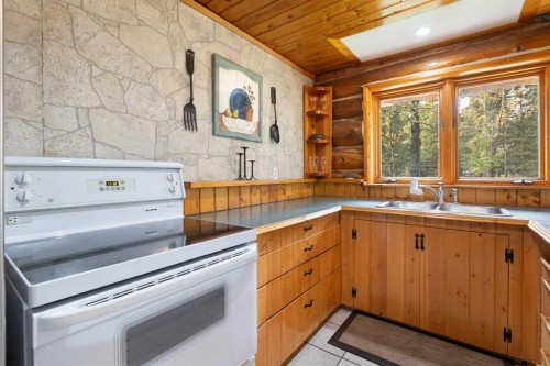 4-29415 Range Road 52, Rural Mountain View County, AB - Indoor Photo Showing Kitchen With Double Sink