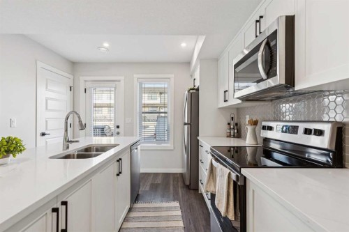 703-135 Mahogany Parade Se, Calgary, AB - Indoor Photo Showing Kitchen With Stainless Steel Kitchen With Double Sink With Upgraded Kitchen