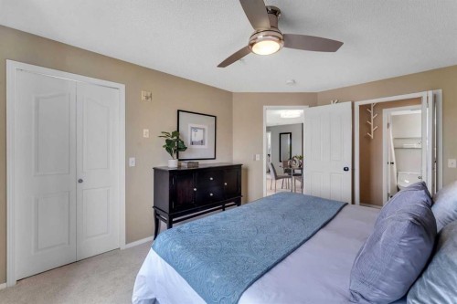 8328-304 Mackenzie Way Sw, Airdrie, AB - Indoor Photo Showing Bedroom