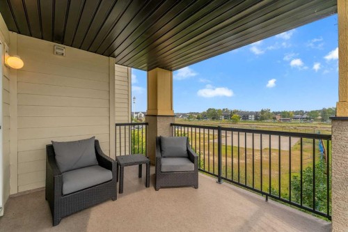 8328-304 Mackenzie Way Sw, Airdrie, AB - Outdoor With Deck Patio Veranda With Exterior