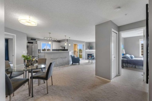 8328-304 Mackenzie Way Sw, Airdrie, AB - Indoor Photo Showing Dining Room