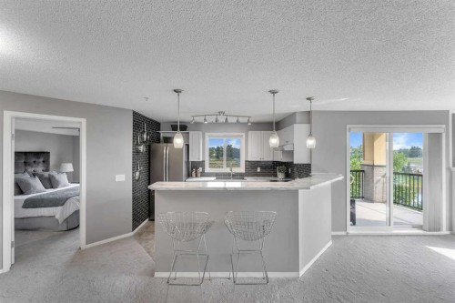 8328-304 Mackenzie Way Sw, Airdrie, AB - Indoor Photo Showing Kitchen