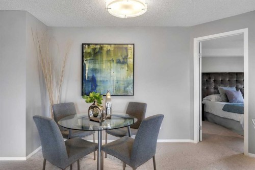 8328-304 Mackenzie Way Sw, Airdrie, AB - Indoor Photo Showing Dining Room