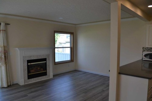 21 Country Hills Rise Nw, Calgary, AB - Indoor Photo Showing Living Room With Fireplace