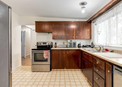 70 Allandale Close Se, Calgary, AB - Indoor Photo Showing Kitchen With Double Sink