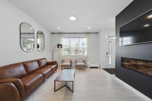 47 Edith Terrace Nw, Calgary, AB - Indoor Photo Showing Living Room With Fireplace
