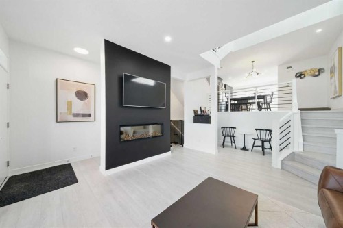 47 Edith Terrace Nw, Calgary, AB - Indoor Photo Showing Other Room With Fireplace