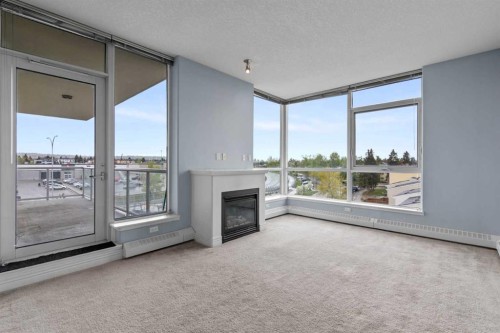407-55 Spruce Place Sw, Calgary, AB - Indoor Photo Showing Other Room With Fireplace