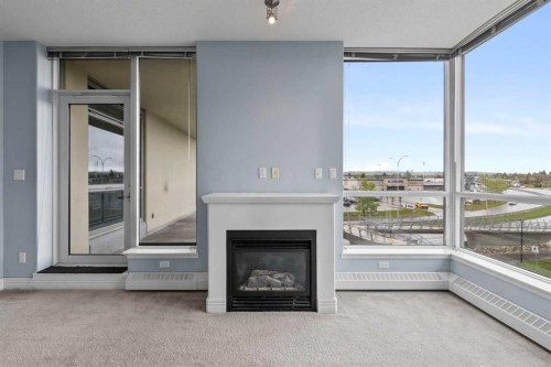 407-55 Spruce Place Sw, Calgary, AB - Indoor Photo Showing Other Room With Fireplace