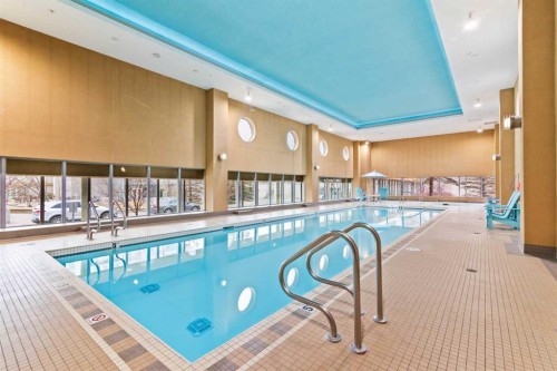 407-55 Spruce Place Sw, Calgary, AB - Indoor Photo Showing Other Room With In Ground Pool