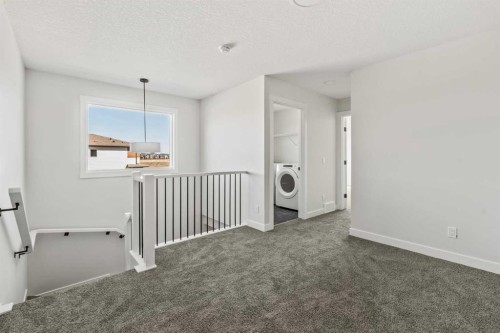 31 Setonvista Way Se, Calgary, AB - Indoor Photo Showing Other Room