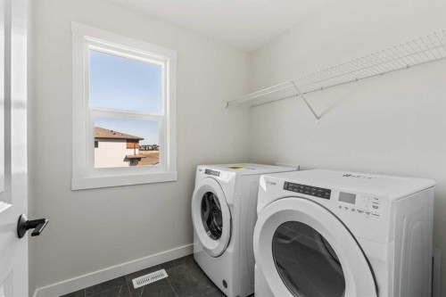 31 Setonvista Way Se, Calgary, AB - Indoor Photo Showing Laundry Room