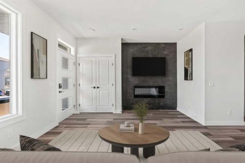 31 Setonvista Way Se, Calgary, AB - Indoor Photo Showing Living Room With Fireplace