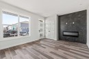 31 Setonvista Way Se, Calgary, AB  - Indoor Photo Showing Living Room With Fireplace 