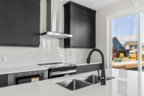 31 Setonvista Way Se, Calgary, AB - Indoor Photo Showing Kitchen With Double Sink With Upgraded Kitchen