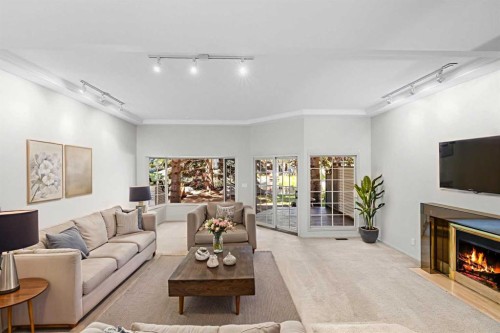 238-4037 42 Street Nw, Calgary, AB - Indoor Photo Showing Living Room With Fireplace