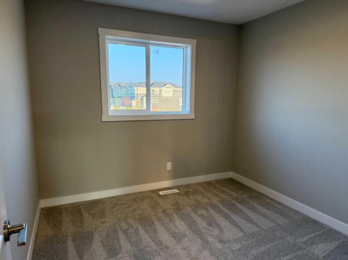 302 Sundown Road, Cochrane, AB - Indoor Photo Showing Other Room