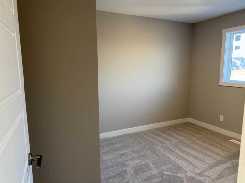 302 Sundown Road, Cochrane, AB - Indoor Photo Showing Other Room