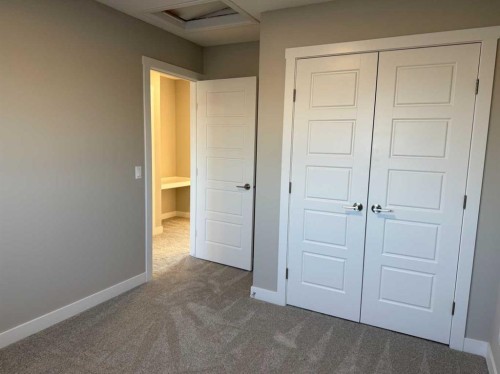 302 Sundown Road, Cochrane, AB - Indoor Photo Showing Other Room