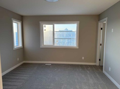 302 Sundown Road, Cochrane, AB - Indoor Photo Showing Other Room