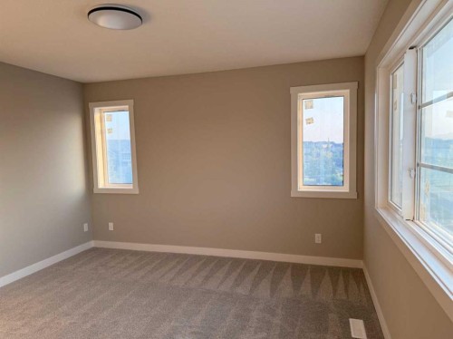 302 Sundown Road, Cochrane, AB - Indoor Photo Showing Other Room