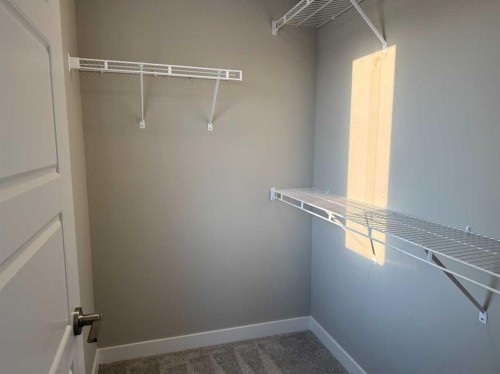 302 Sundown Road, Cochrane, AB - Indoor With Storage