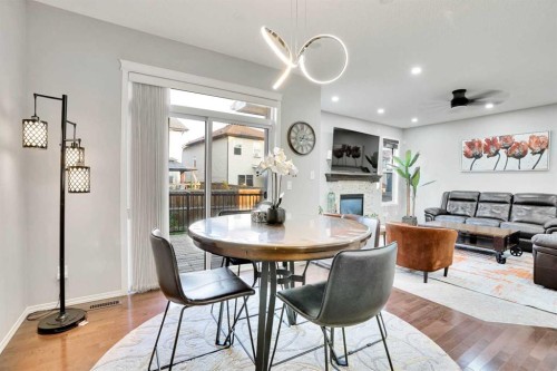 124 Skyview Shores Road Ne, Calgary, AB - Indoor Photo Showing Dining Room With Fireplace