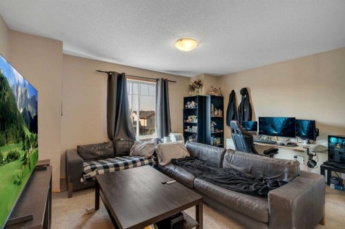 100 Covecreek Close Ne, Calgary, AB - Indoor Photo Showing Living Room