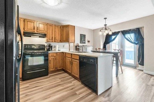 36 Millside Way Sw, Calgary, AB - Indoor Photo Showing Kitchen With Double Sink