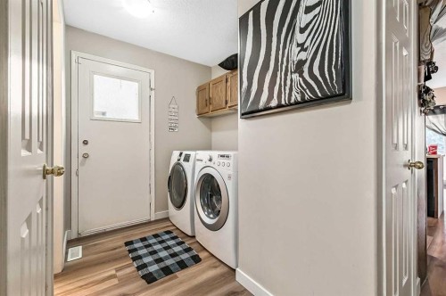 36 Millside Way Sw, Calgary, AB - Indoor Photo Showing Laundry Room