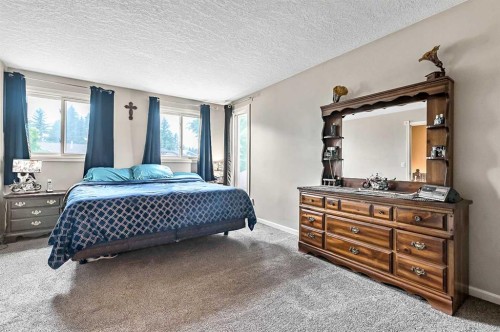 36 Millside Way Sw, Calgary, AB - Indoor Photo Showing Bedroom
