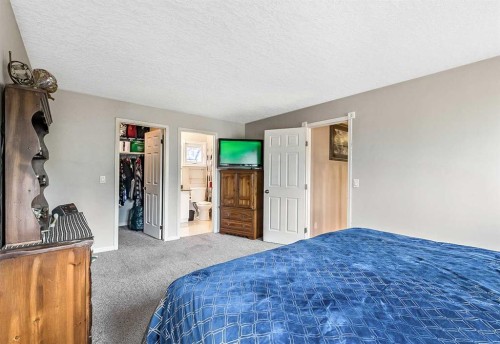 36 Millside Way Sw, Calgary, AB - Indoor Photo Showing Bedroom