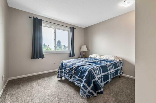 36 Millside Way Sw, Calgary, AB - Indoor Photo Showing Bedroom