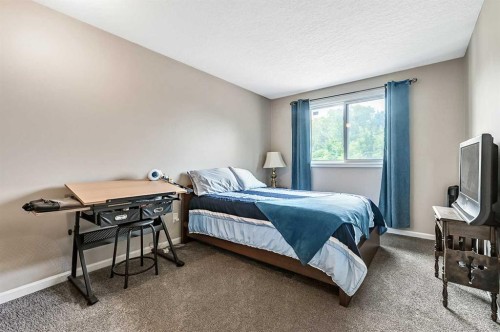 36 Millside Way Sw, Calgary, AB - Indoor Photo Showing Bedroom
