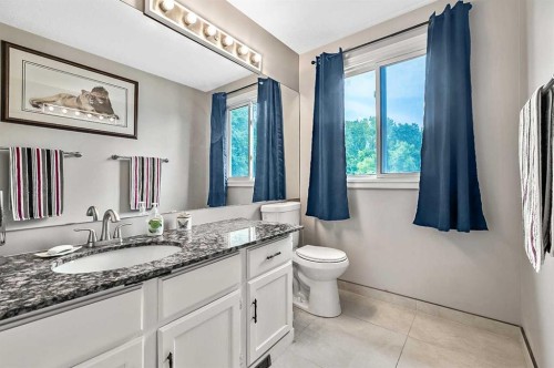 36 Millside Way Sw, Calgary, AB - Indoor Photo Showing Bathroom