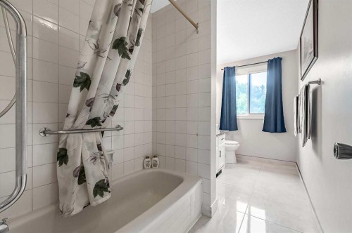 36 Millside Way Sw, Calgary, AB - Indoor Photo Showing Bathroom