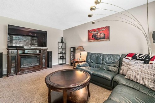 36 Millside Way Sw, Calgary, AB - Indoor Photo Showing Living Room