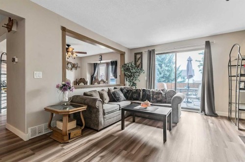 36 Millside Way Sw, Calgary, AB - Indoor Photo Showing Living Room