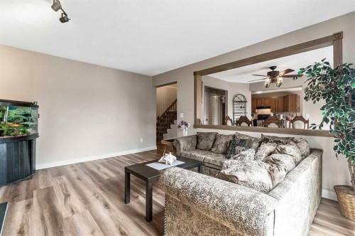 36 Millside Way Sw, Calgary, AB - Indoor Photo Showing Living Room