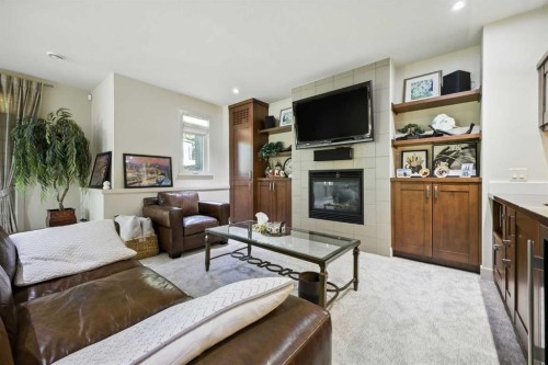 16 Spring Valley Lane Sw, Calgary, AB - Indoor Photo Showing Living Room With Fireplace