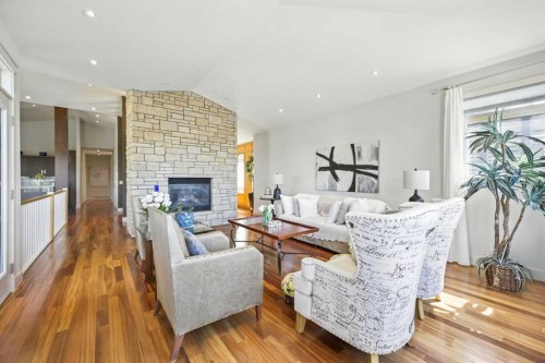 16 Spring Valley Lane Sw, Calgary, AB - Indoor Photo Showing Living Room With Fireplace