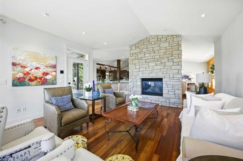 16 Spring Valley Lane Sw, Calgary, AB - Indoor Photo Showing Living Room With Fireplace
