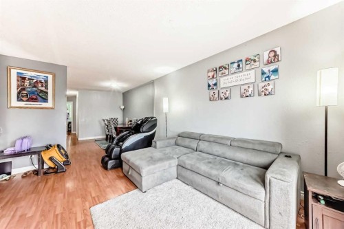 203 Penbrooke Close Se, Calgary, AB - Indoor Photo Showing Living Room
