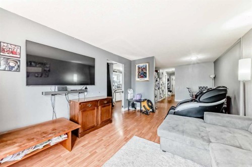 203 Penbrooke Close Se, Calgary, AB - Indoor Photo Showing Living Room