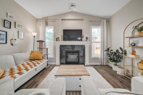 593 Nolan Hill Boulevard Nw, Calgary, AB - Indoor Photo Showing Living Room With Fireplace