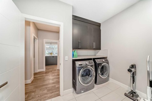 213 Springbluff Boulevard Sw, Calgary, AB - Indoor Photo Showing Laundry Room