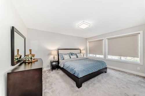 213 Springbluff Boulevard Sw, Calgary, AB - Indoor Photo Showing Bedroom