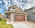 213 Springbluff Boulevard Sw, Calgary, AB  - Outdoor With Facade 