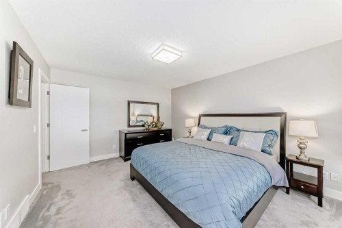 213 Springbluff Boulevard Sw, Calgary, AB - Indoor Photo Showing Bedroom