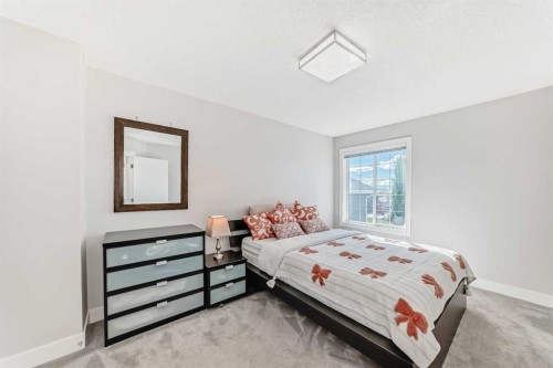 213 Springbluff Boulevard Sw, Calgary, AB - Indoor Photo Showing Bedroom